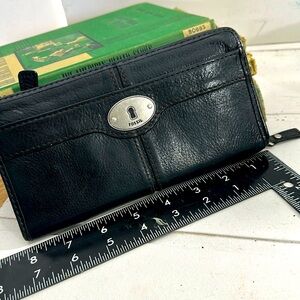 Fossil vintage black pebbled leather check book length wallet.